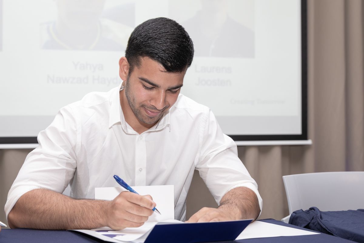 Yahya providing physiotherapy treatment